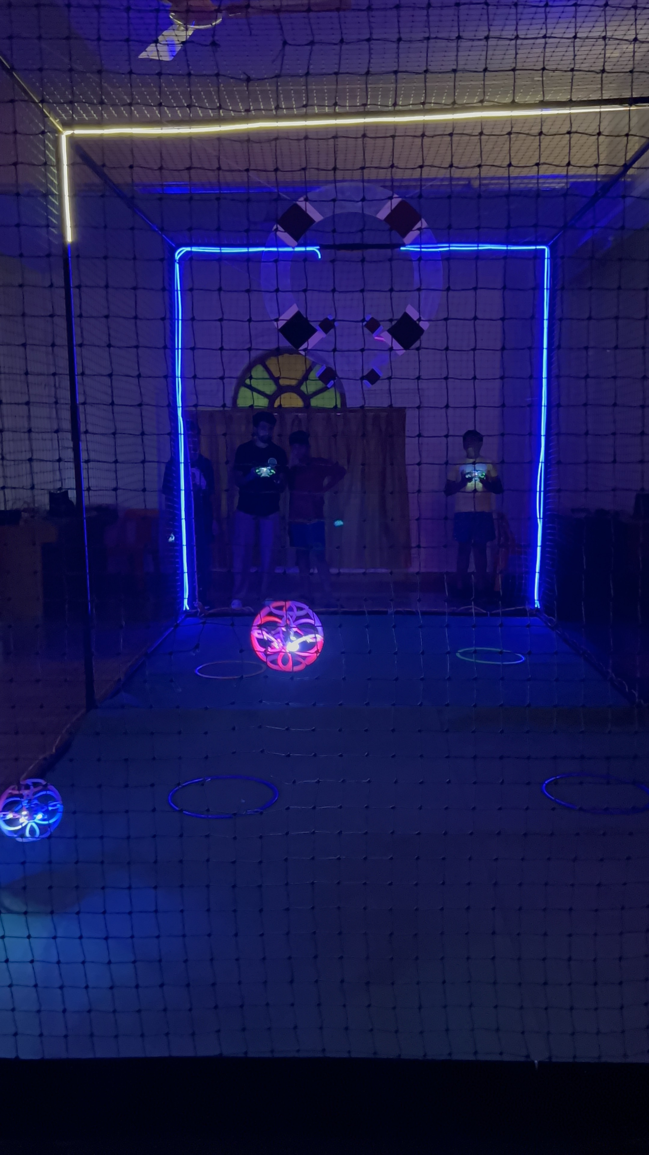 Blue light arena with a glowing ball